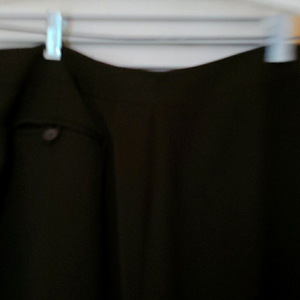 Super cute skirt with back buttoned pocket. Rich B